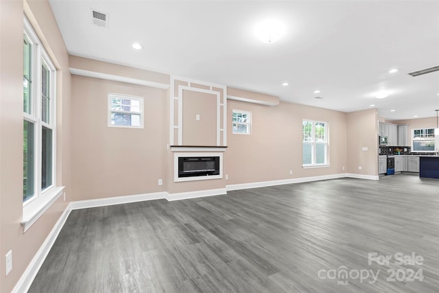 unfurnished living room featuring hardwood / wood-style floors