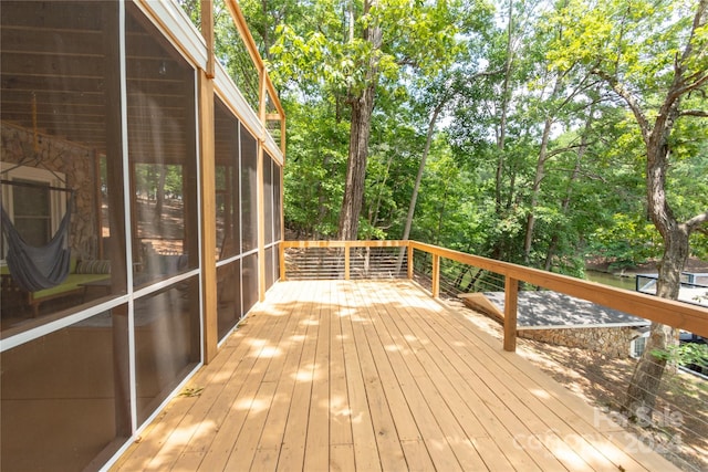 wooden terrace featuring a sunroom