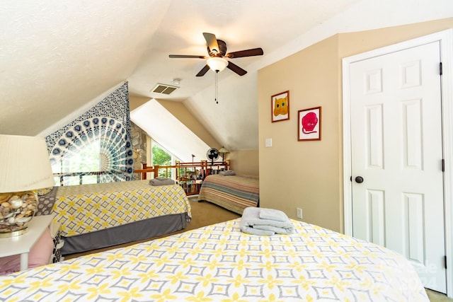 bedroom with lofted ceiling and ceiling fan