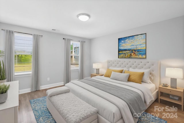 bedroom featuring hardwood / wood-style floors