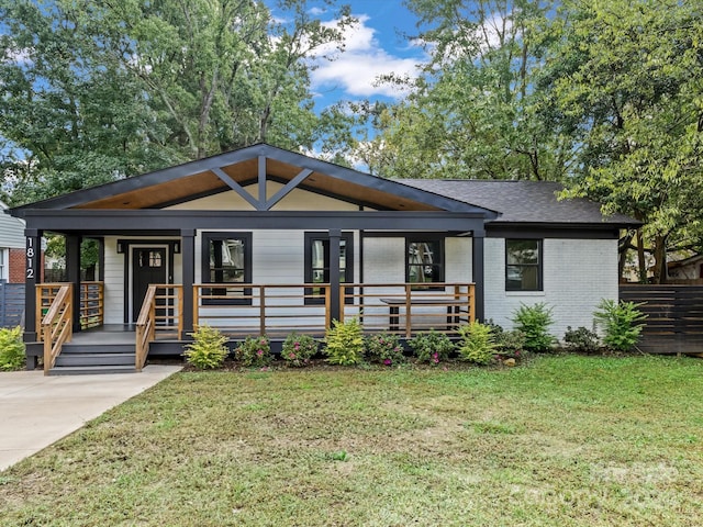 view of front of home featuring a front lawn and a porch