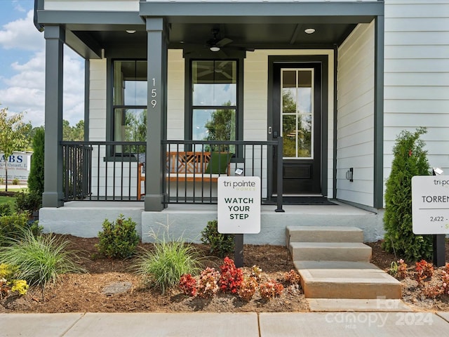 property entrance with covered porch