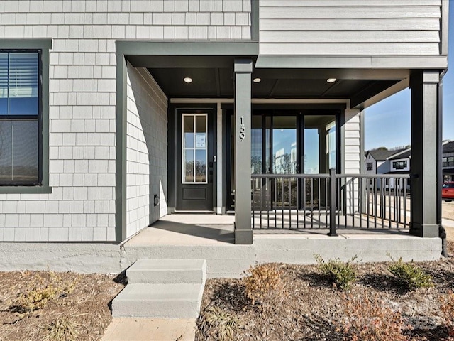 property entrance featuring covered porch