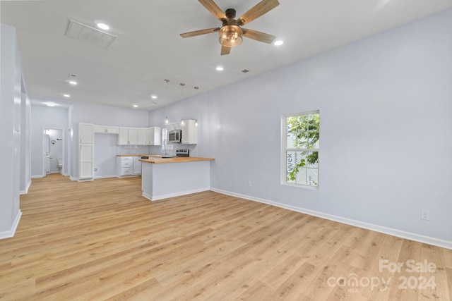 unfurnished living room with light hardwood / wood-style floors and ceiling fan