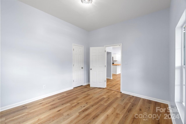 unfurnished bedroom with light hardwood / wood-style floors