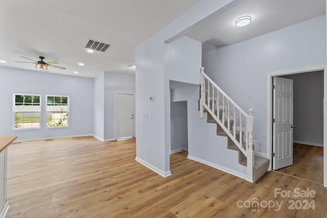 interior space with ceiling fan and light hardwood / wood-style flooring