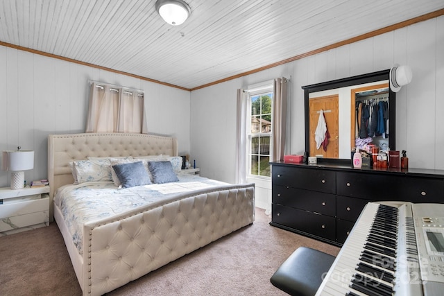 carpeted bedroom featuring crown molding