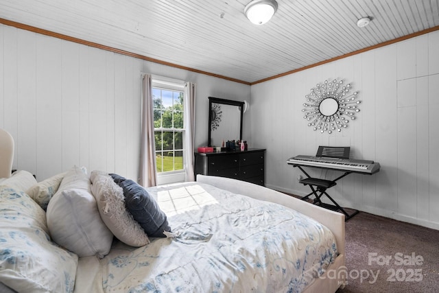 bedroom with ornamental molding and carpet floors