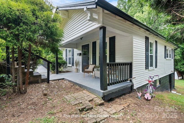 view of side of property with a patio area