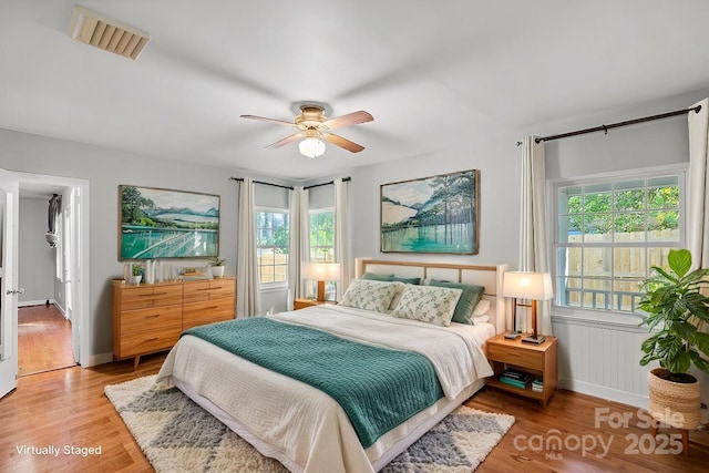 bedroom featuring ceiling fan and light wood-type flooring