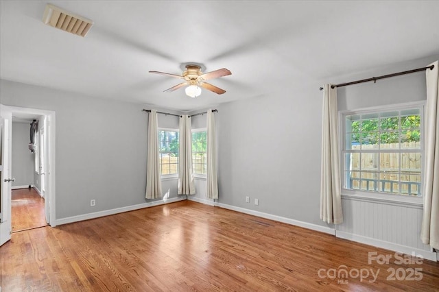 spare room with ceiling fan and light hardwood / wood-style flooring