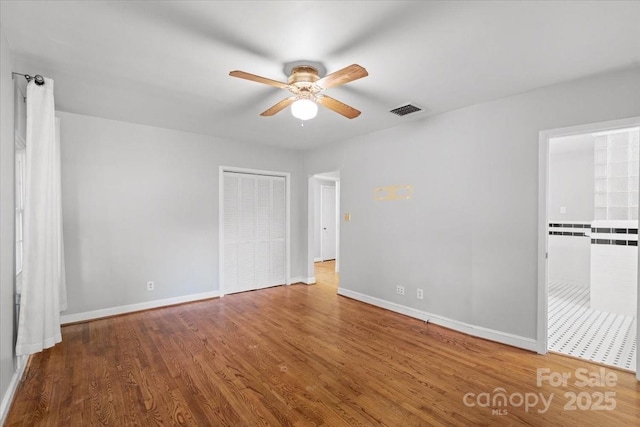 unfurnished room featuring wood-type flooring and ceiling fan