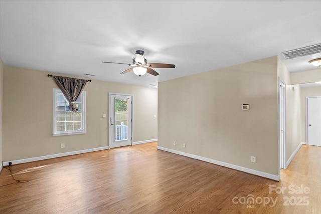 spare room with ceiling fan and light hardwood / wood-style flooring