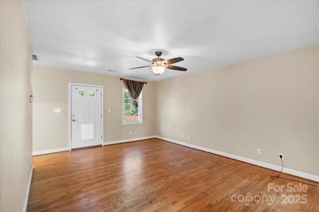 unfurnished room featuring wood-type flooring and ceiling fan