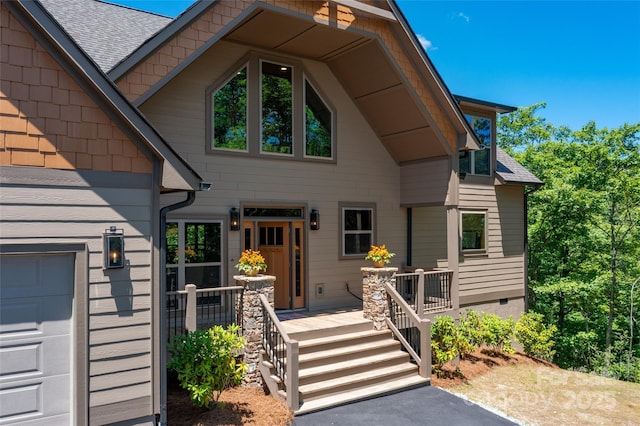 view of front of property featuring a garage and covered porch