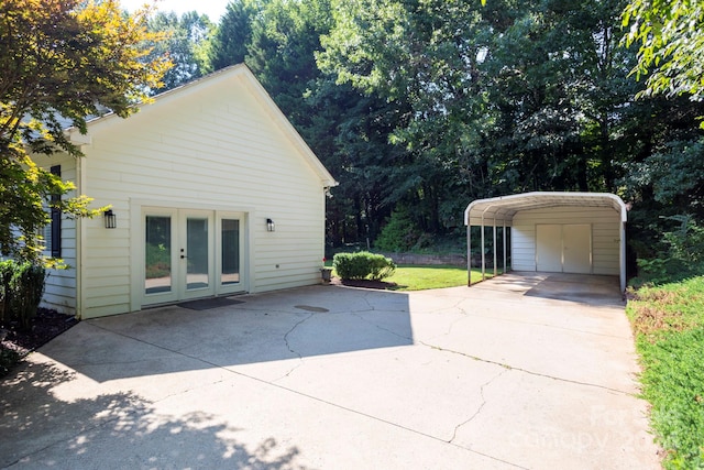 exterior space with french doors and a carport