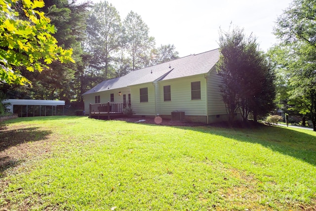 exterior space featuring a wooden deck and a yard