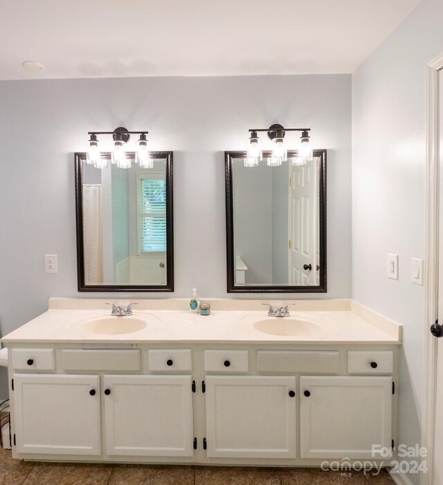 bathroom with tile patterned flooring and vanity