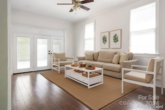 living room with dark wood-type flooring, ceiling fan, and a wealth of natural light