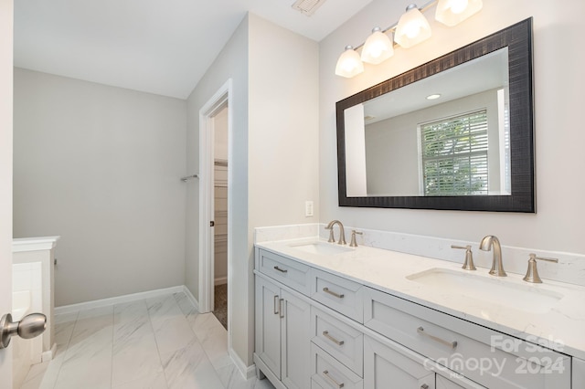 bathroom with tile patterned flooring and vanity