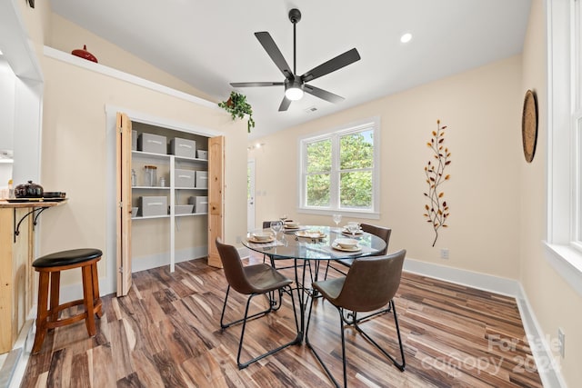 dining room with vaulted ceiling, ceiling fan, and hardwood / wood-style floors