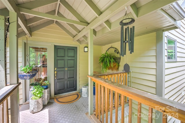 doorway to property with a porch
