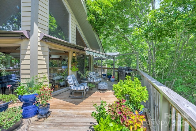 wooden deck featuring area for grilling