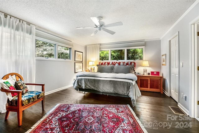 bedroom featuring ornamental molding, visible vents, and multiple windows