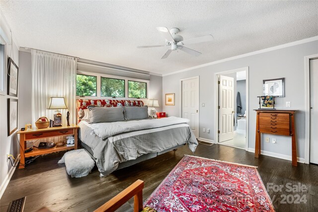 bedroom featuring baseboards, visible vents, a textured ceiling, and crown molding