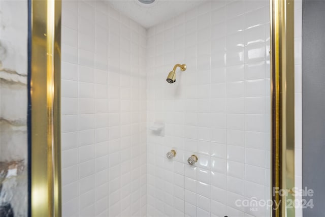 full bath with a shower stall