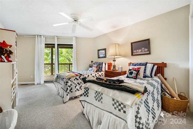 bedroom featuring access to exterior, carpet flooring, baseboards, and a ceiling fan