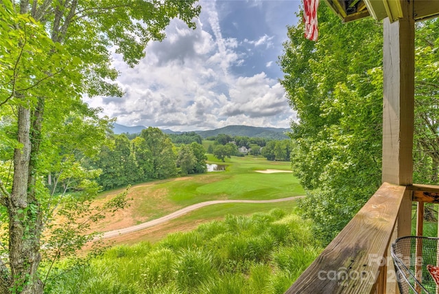 view of community with golf course view and a mountain view