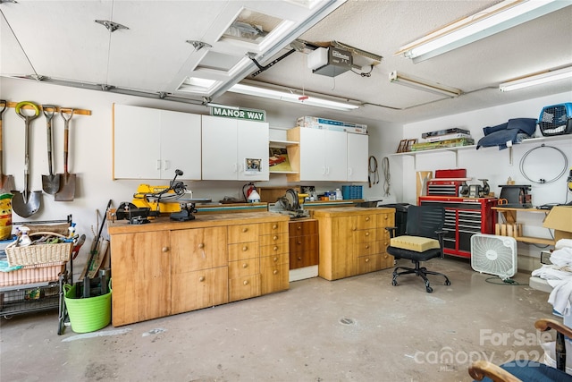 interior space featuring a garage door opener and a workshop area