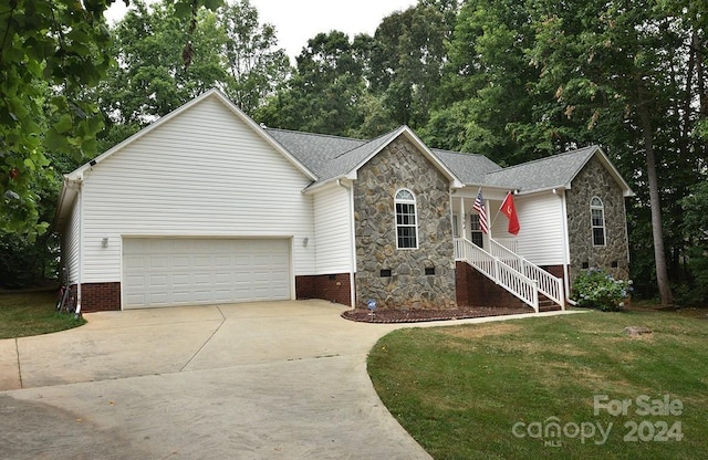 ranch-style home featuring concrete driveway, a front lawn, crawl space, and stone siding