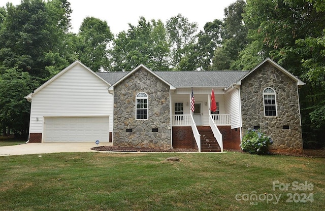 single story home with crawl space, covered porch, a front lawn, and concrete driveway