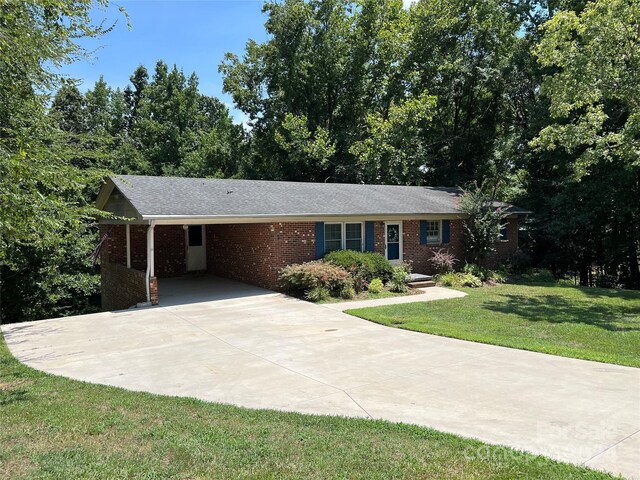 single story home with a carport and a front lawn