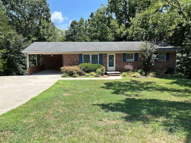 ranch-style house with a front yard and a carport