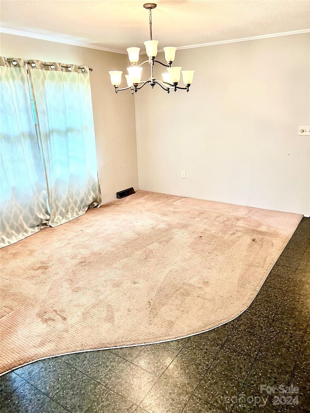 unfurnished dining area featuring an inviting chandelier and crown molding