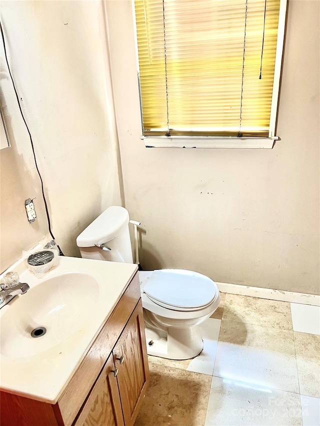 bathroom featuring toilet and vanity