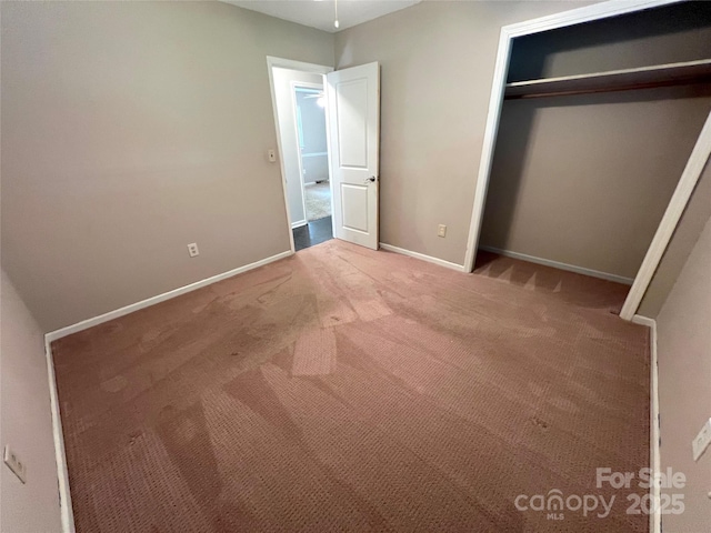 1111 S Skyland Dr, Mount Pleasant, NC 28124 - unfurnished bedroom featuring a closet, baseboards, and carpet