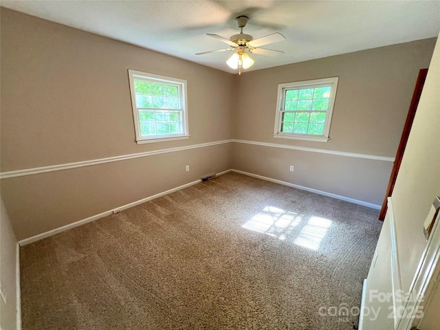 1111 S Skyland Dr, Mount Pleasant, NC 28124 - empty room featuring ceiling fan, baseboards, and carpet