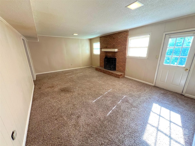 1111 S Skyland Dr, Mount Pleasant, NC 28124 - unfurnished living room with a textured ceiling, baseboards, a brick fireplace, and carpet floors
