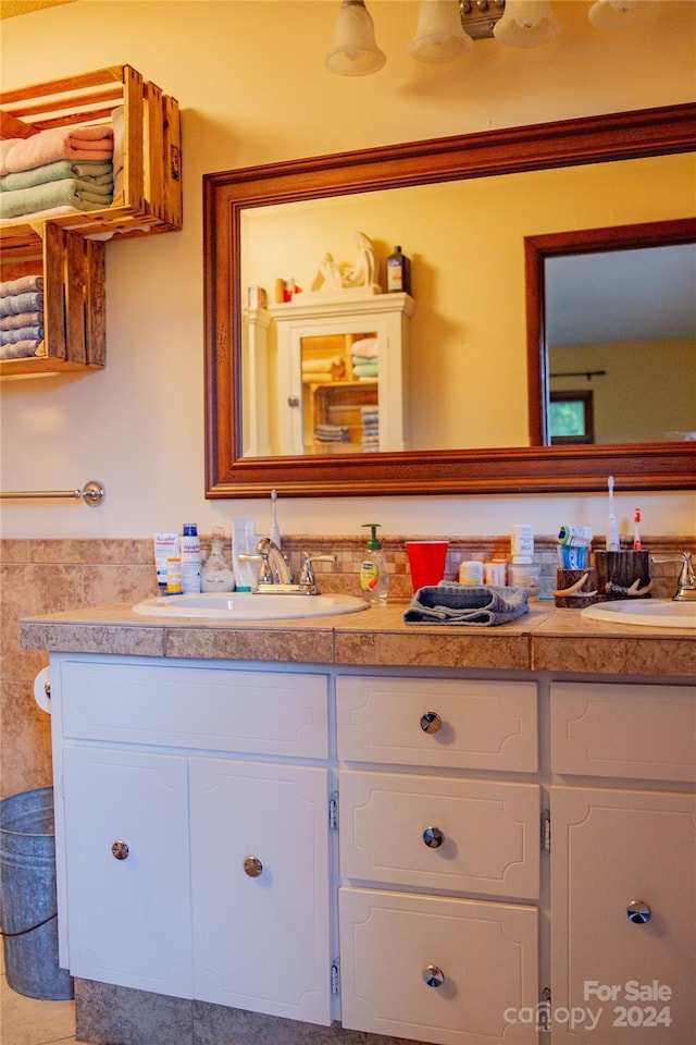 bathroom with vanity and ornamental molding