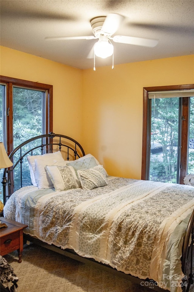 bedroom featuring ceiling fan and carpet floors