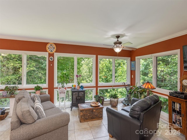 sunroom featuring ceiling fan and a healthy amount of sunlight