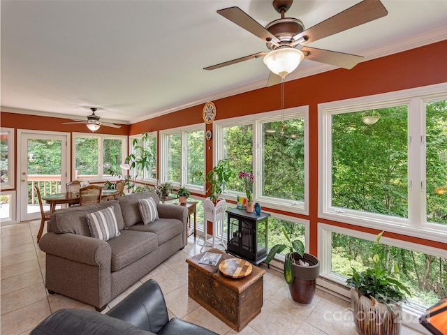 sunroom with a wealth of natural light and ceiling fan