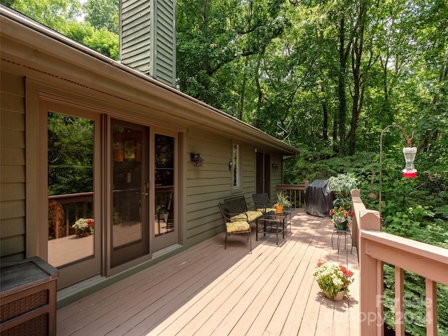 wooden terrace with area for grilling