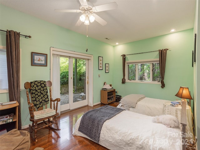 bedroom with hardwood / wood-style floors, ceiling fan, and access to exterior