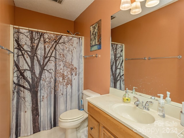 bathroom featuring a shower with curtain, vanity, a textured ceiling, and toilet