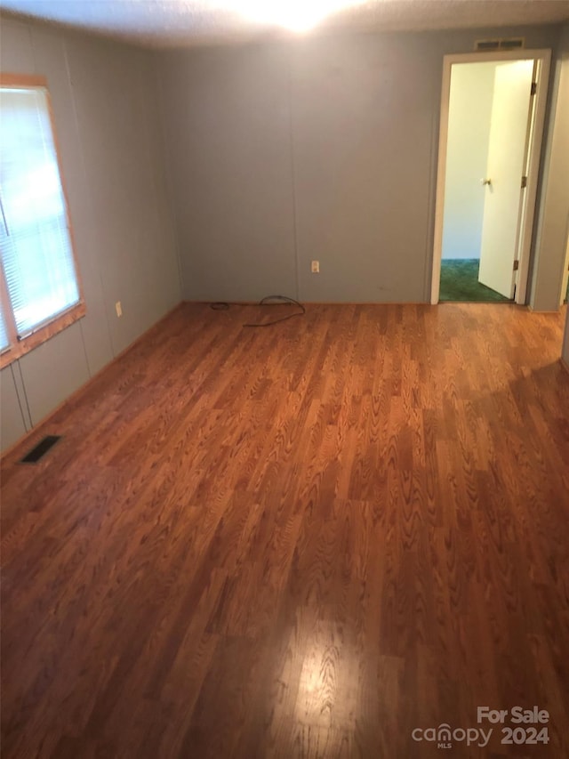 empty room featuring hardwood / wood-style floors